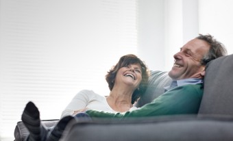 Couple embracing in their home