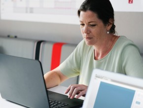 a woman working on a laptop