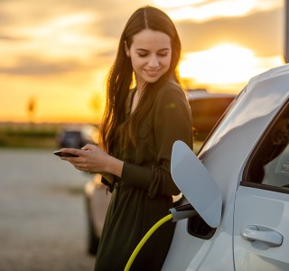 picture of girl charging her electric vehicle