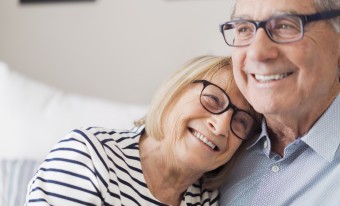 Couple embracing in their home