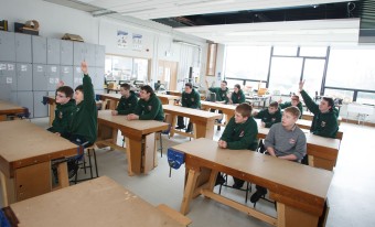 Children in a classroom participating in a lesson