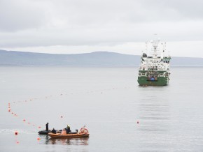 a boat laying fibre optic cable in the ocean