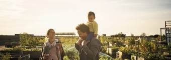 A family walking around a community garden