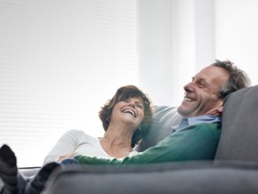 a couple relaxing on a couch in their home