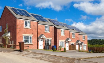 Row of houses with solar panels on the roof