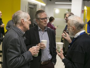 3 members of the community chatting and drinking tea