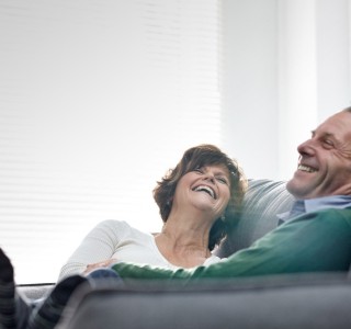 Couple embracing in their home