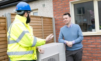 Engineer discussing heating options with consumer