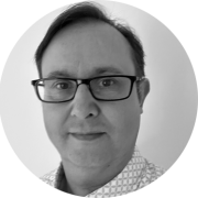 This is a headshot photo of David Thomas.