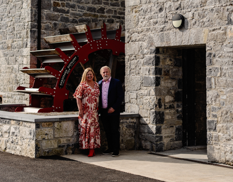 The owners of Ahascragh standing in front of the distillery