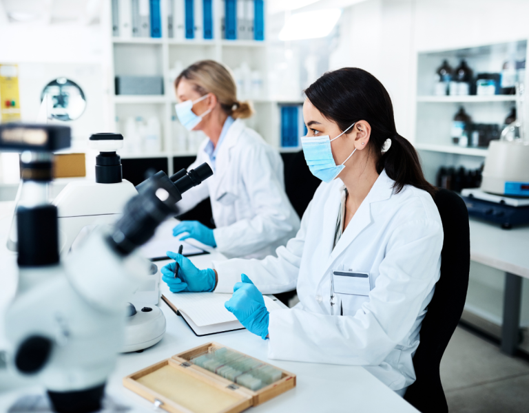 Two scientists working at a desk