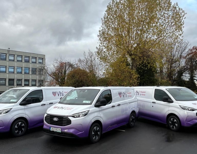Three vans with Vhi branding