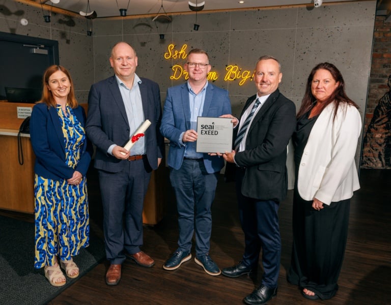 Group of five people posing with EXEED certification