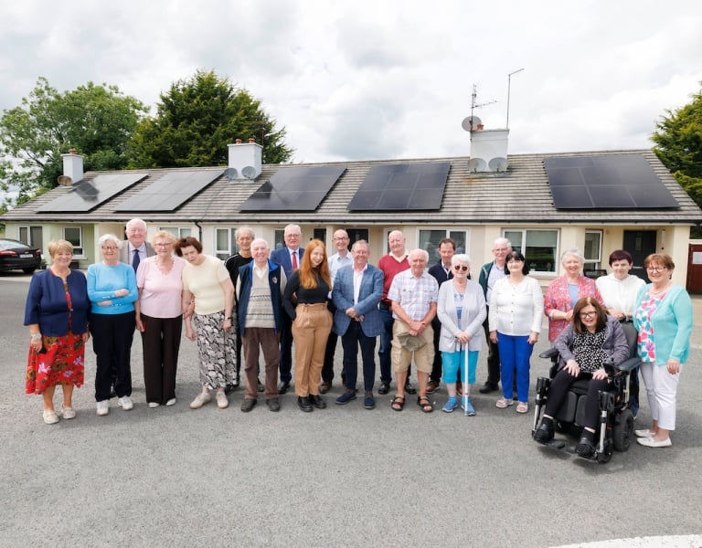 A group photo taken at a housing estate