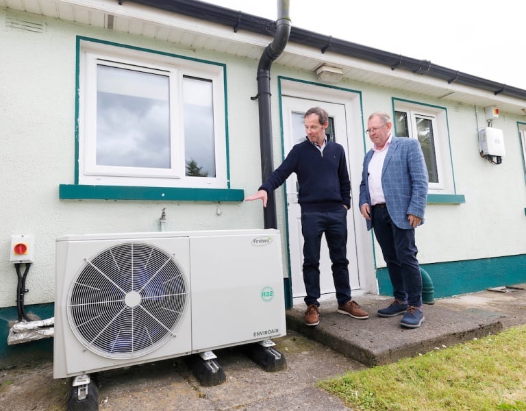 Paul Kilmartin, KH Energy Services and Paul Flynn, SEAI standing beside at heat pump.