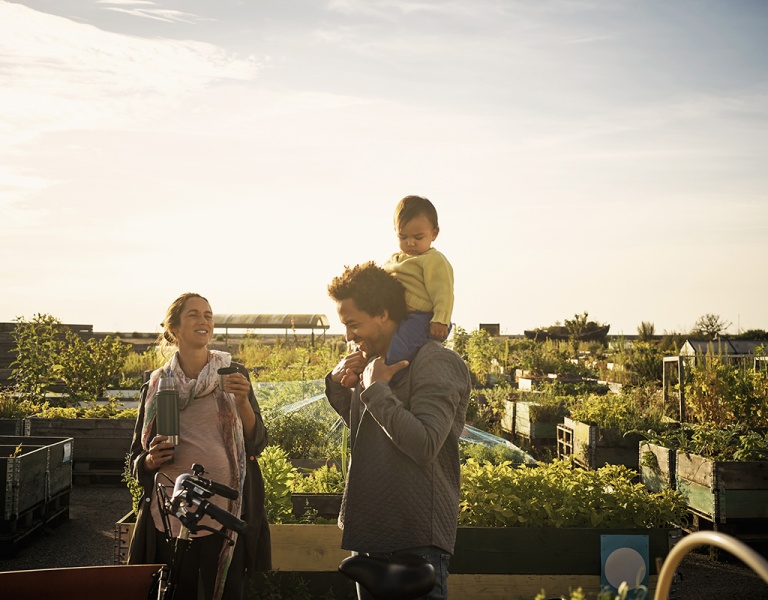 A family walking around a community garden