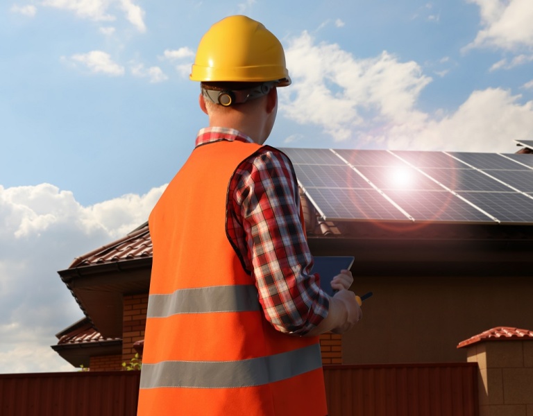 A contractor installing commercial solar PV