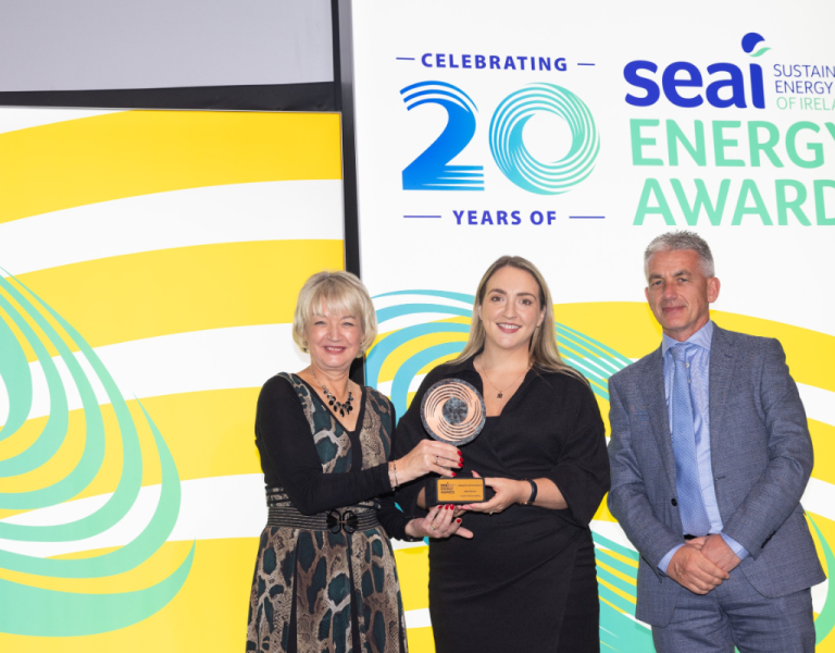 L-R: Marion O'Brien, Director of Corporate Services at SEAI presenting the Excellence in Energy Research and Innovation Award to Laura McMahon and Daniel Ring; of Lawler Sustainability at SEAI Energy Awards 2023