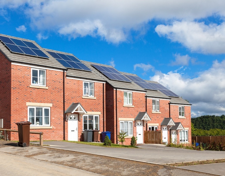 Line of attached houses with solar panels