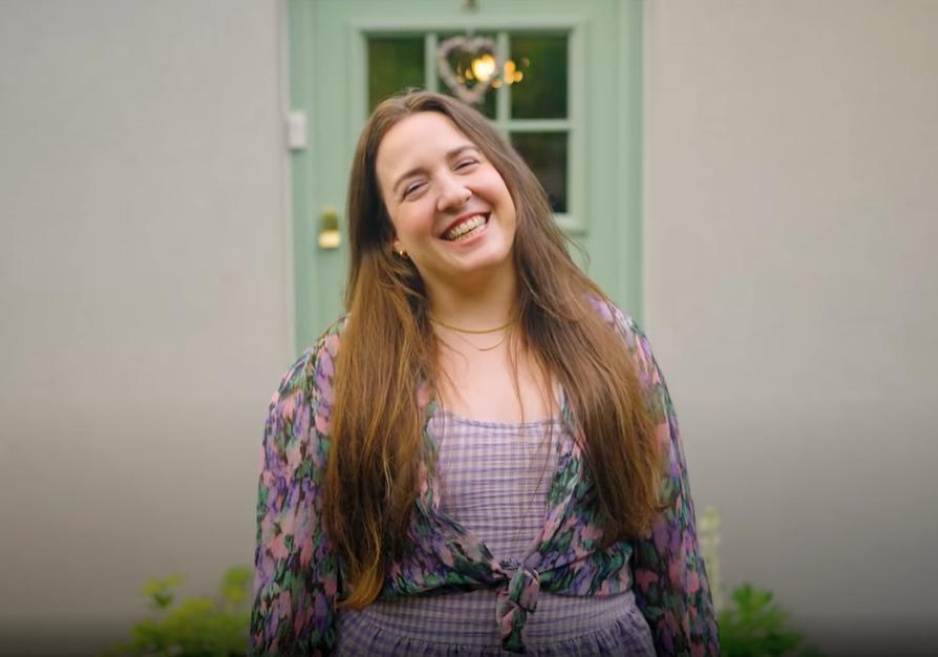 Ellie, a homeowner, outside her newly upgraded house