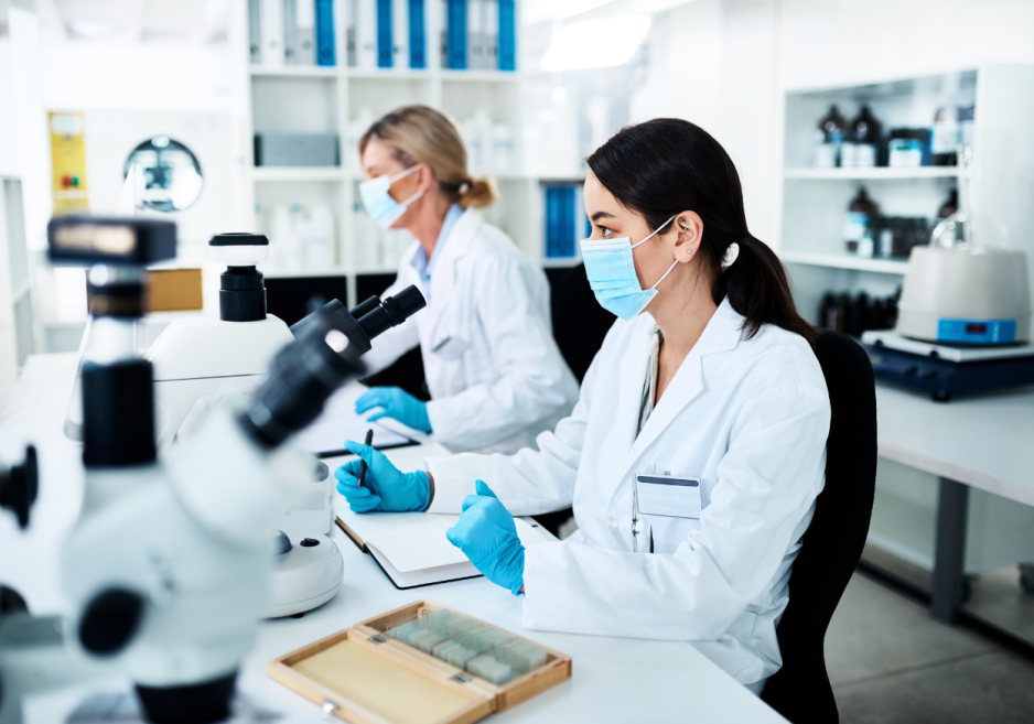Two scientists working at a desk