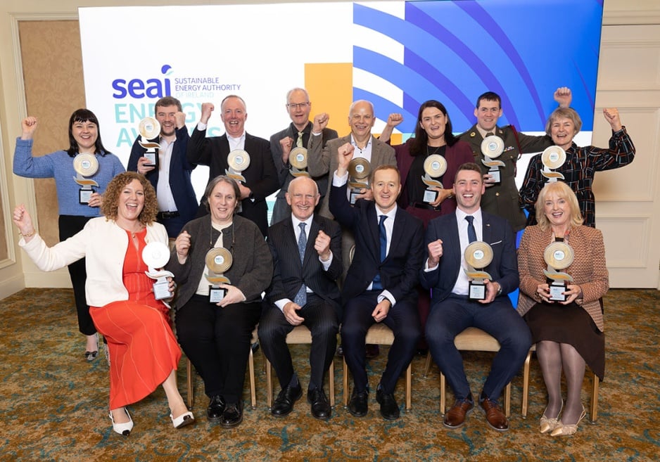 The winners of the SEAI Energy Awards 2025 holding their trophies and smiling.