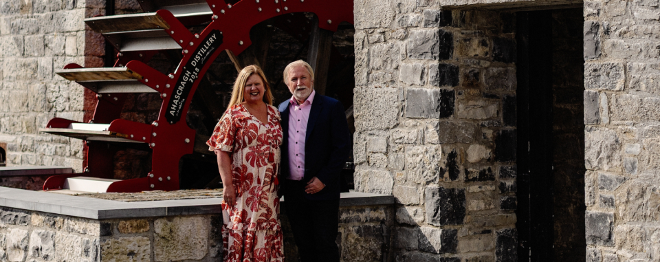 The owners of Ahascragh standing in front of the distillery