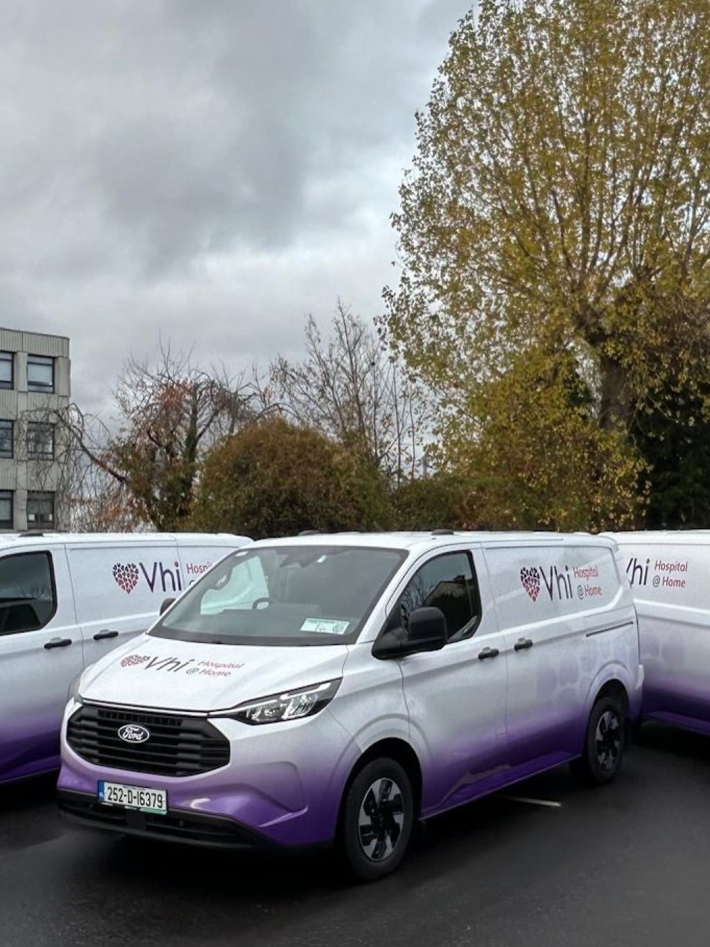 Three vans with Vhi branding