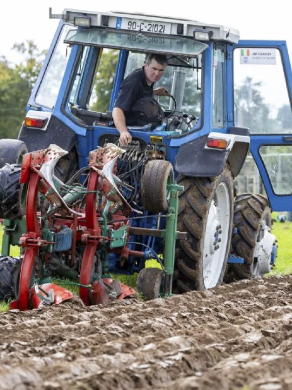 A blue tractor ploughing a field at the National Ploughing Championships 2026