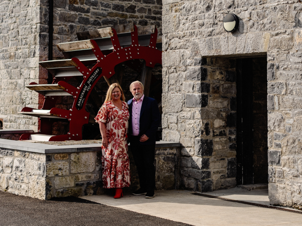 The owners of Ahascragh standing in front of the distillery