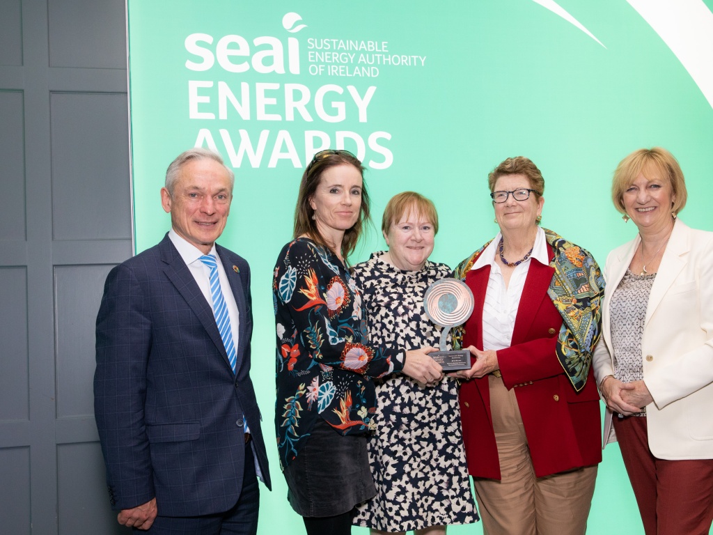 Award winners posing with her award at the SEAI energy awards