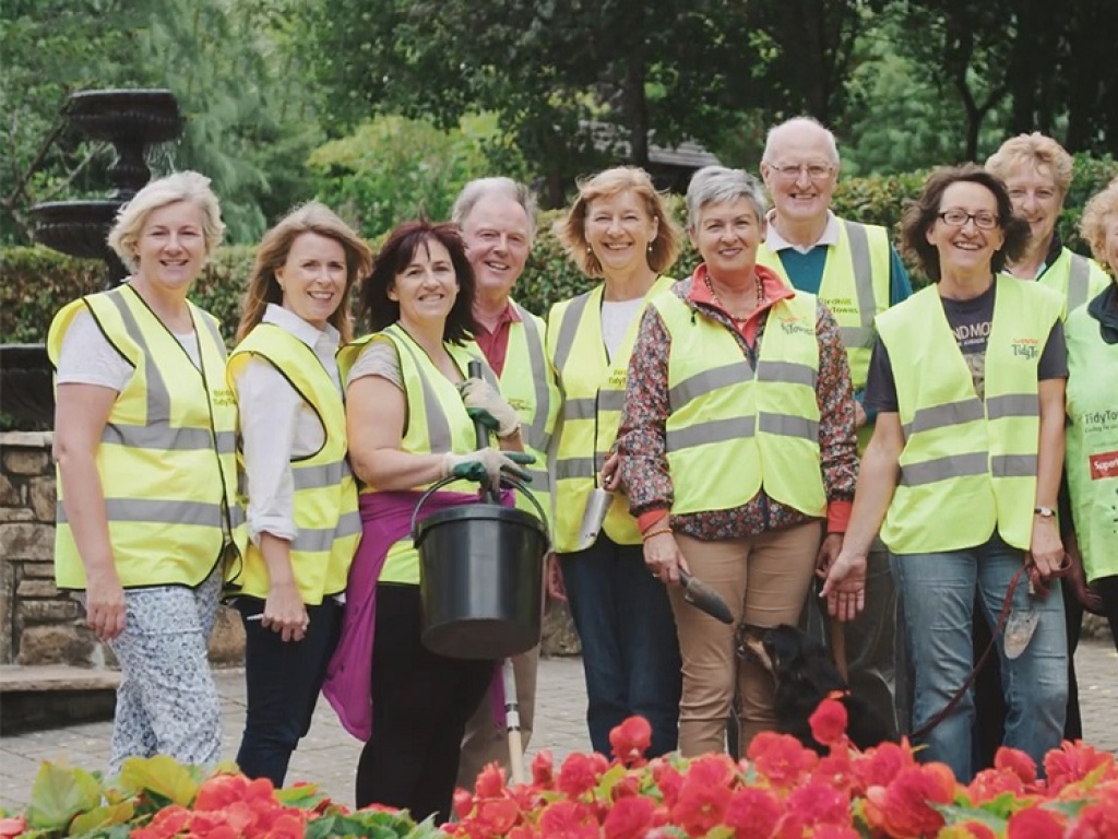 Members of the community in high vis vests gardening